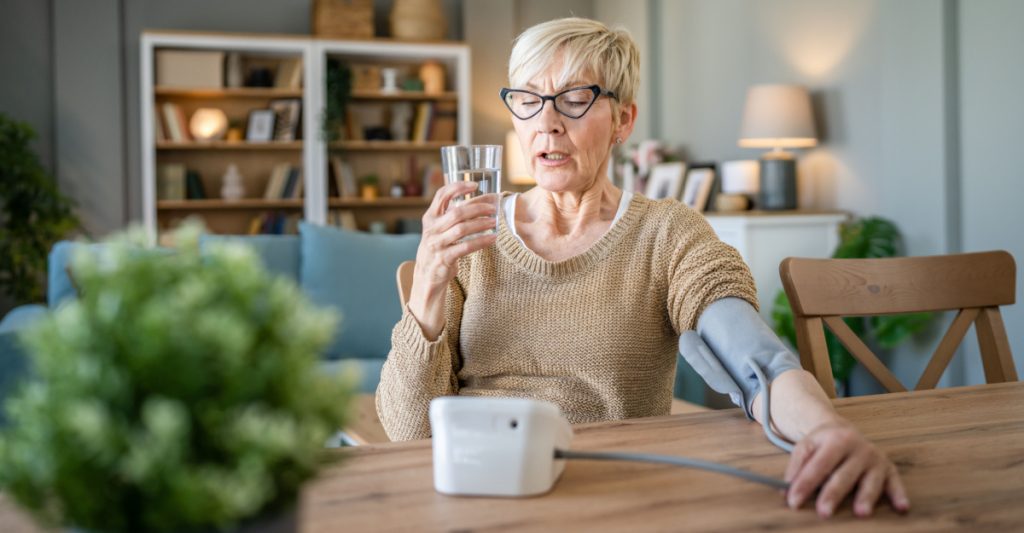 Woman Measuring Her Blood Pressure