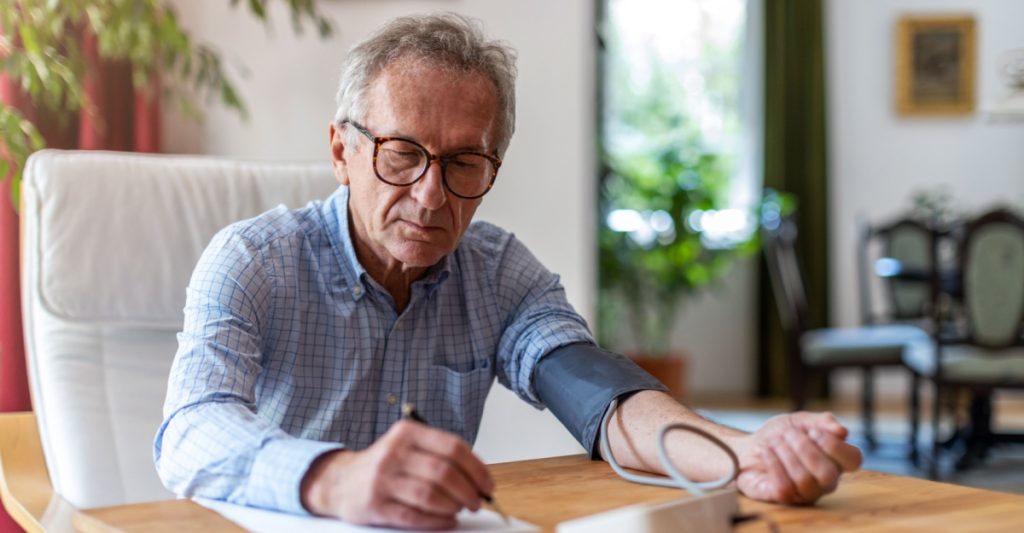 Man Keeping Blood Pressure Log