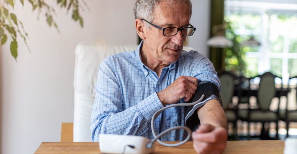 Man Measuring His Blood Pressure