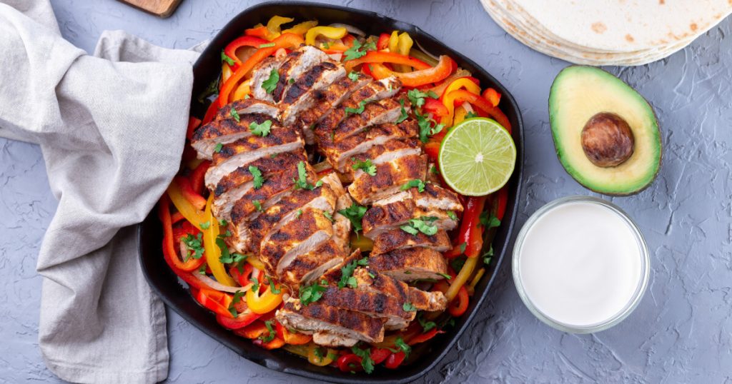 Roasted Chicken Breasts With Peppers in a Plate