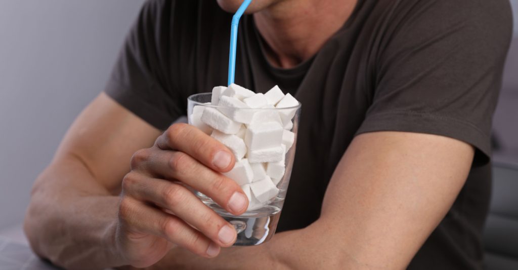 A Man Eating Foods High in Sugar