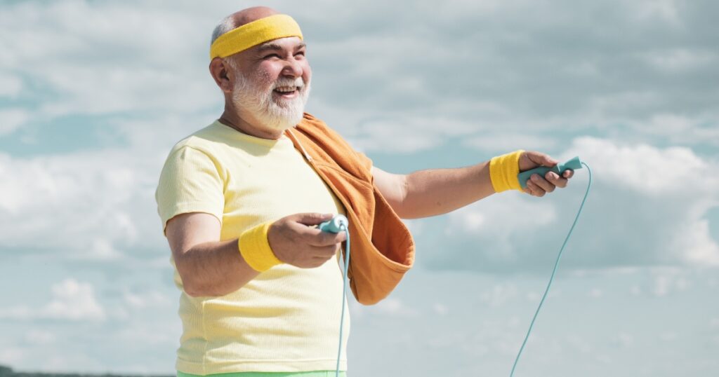 A close up of a man with a jumping rope