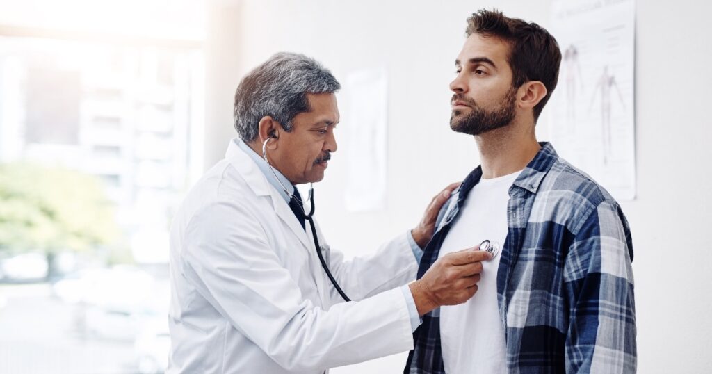 Person sitting in a doctor's office, getting a check-up