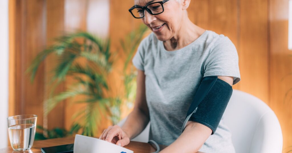 Close up of a woman measuring her blood pressure